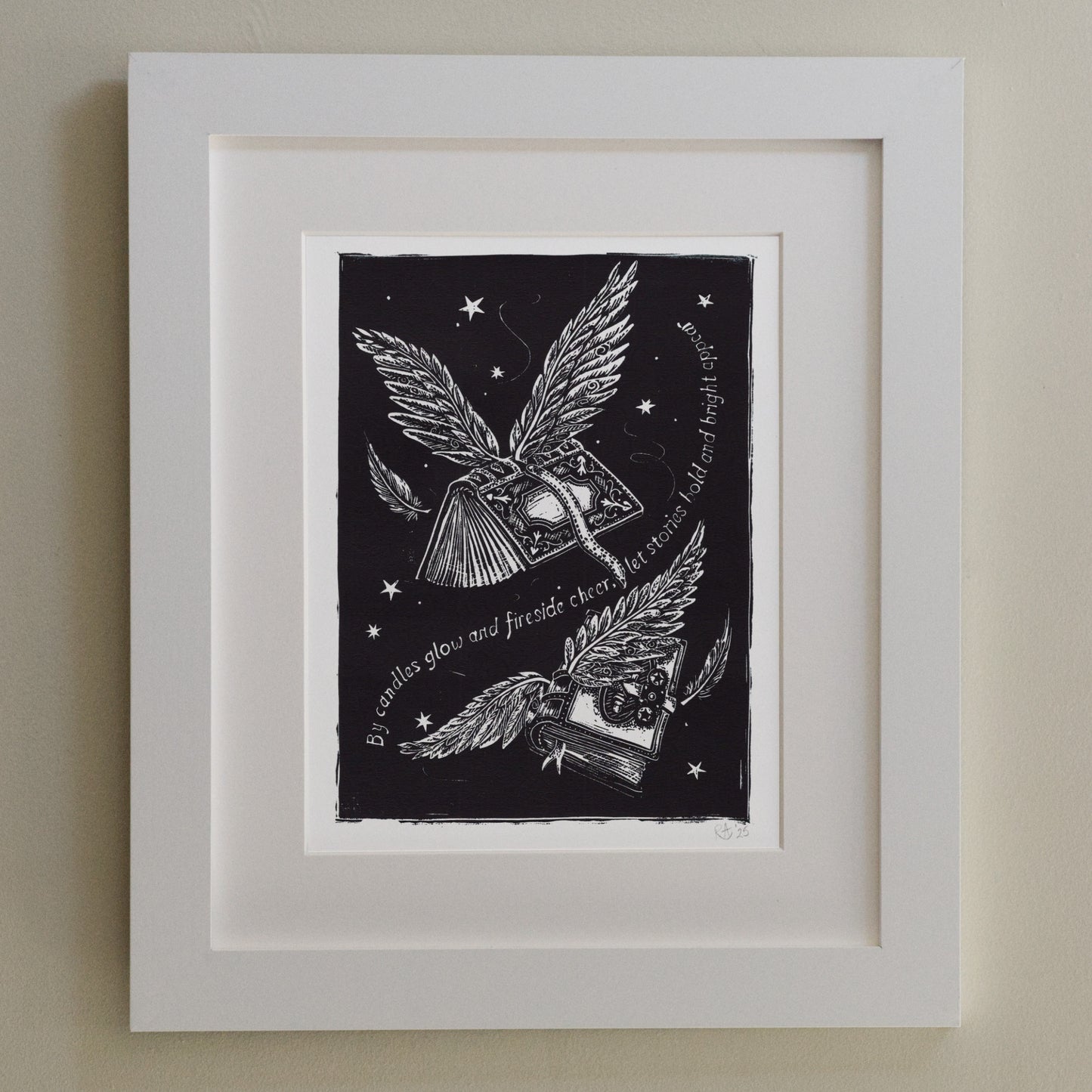 Framed artwork with black and white illustration of wings and text on a dark background.