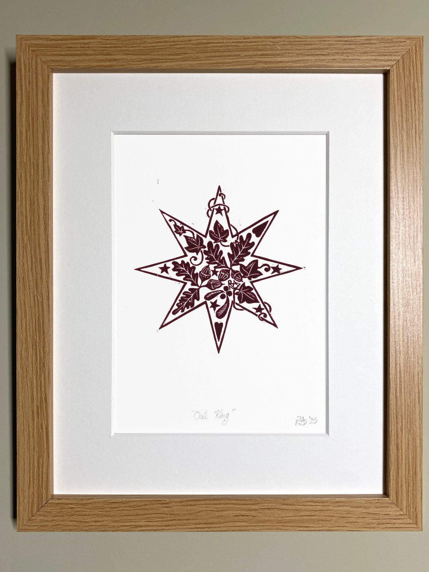 Framed artwork with a star design on a white background