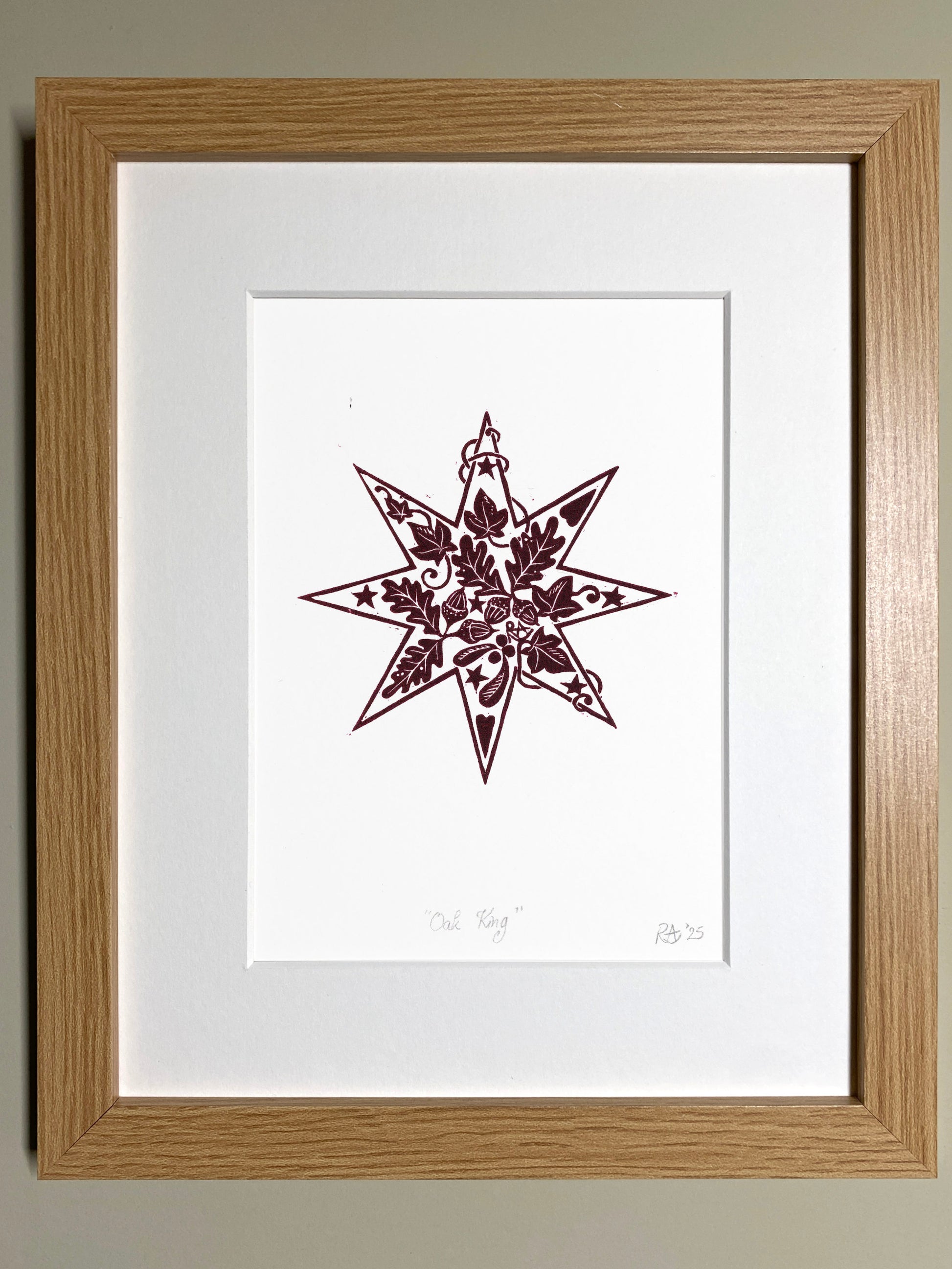Framed artwork with a star design on a white background