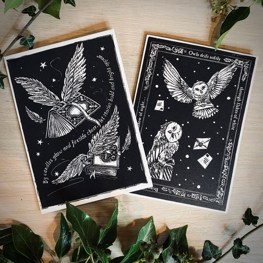 Black and white christmas cards lying on a table