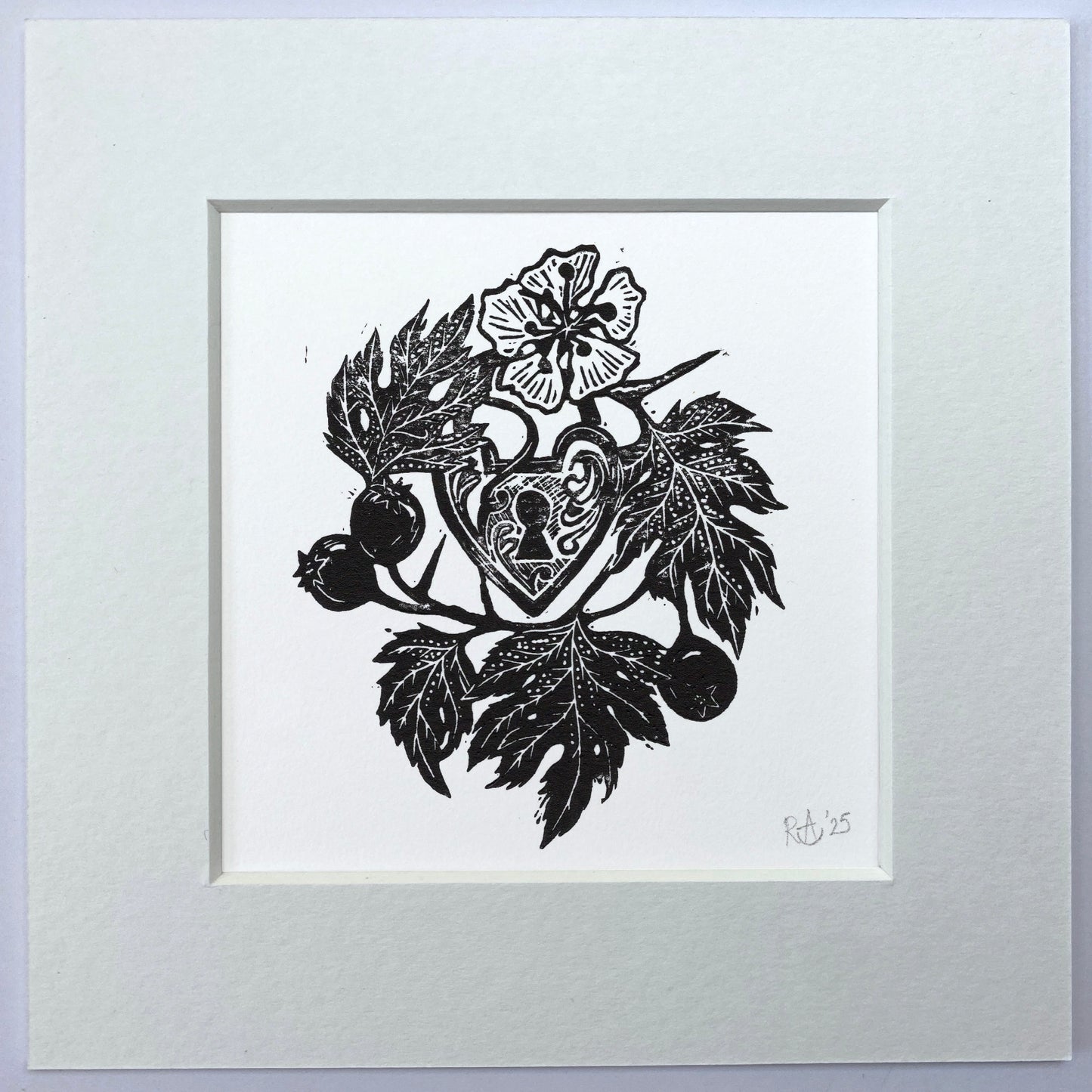 Black and white illustration of a heart with leaves and flowers on a white background