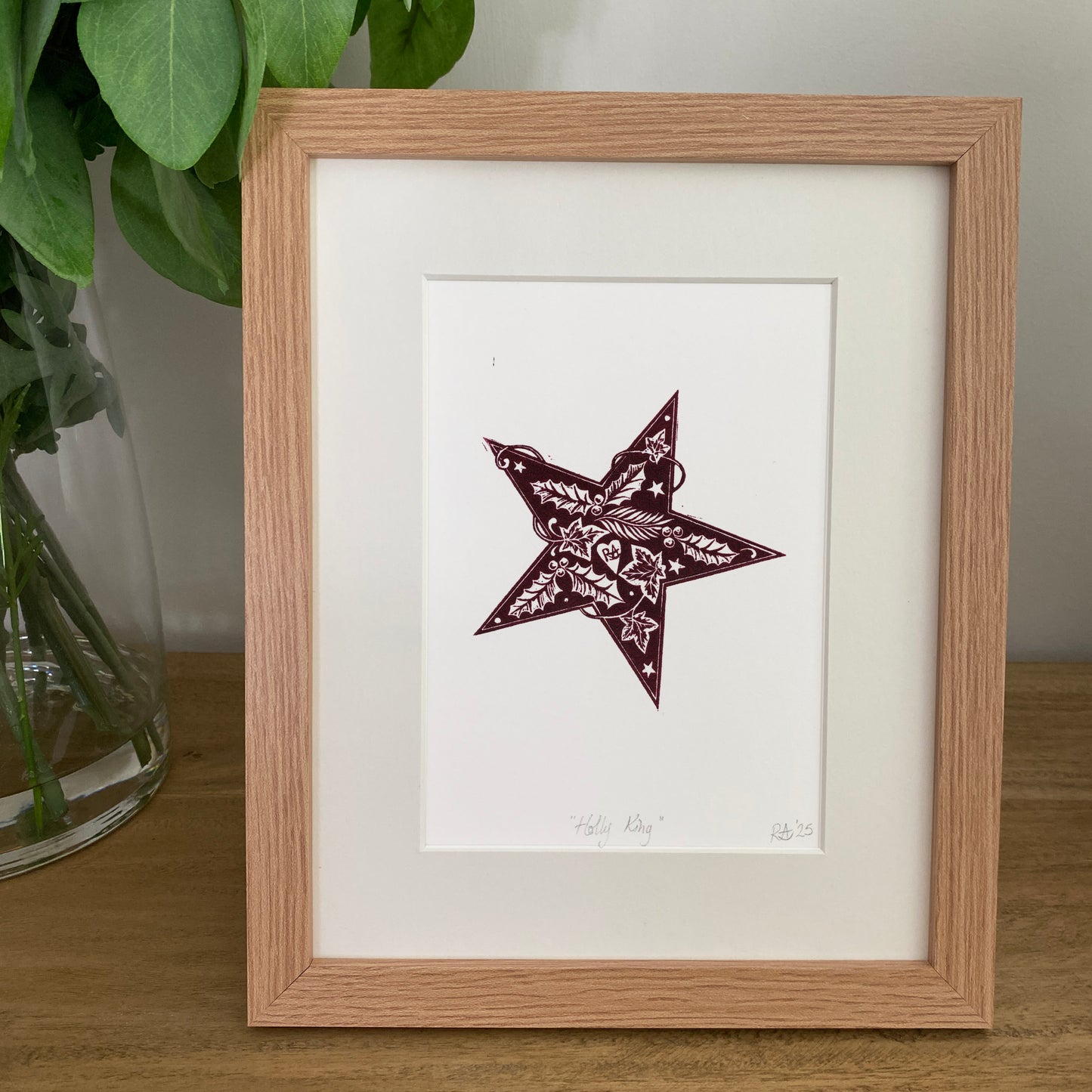 Holly King Star linoprint. Seasonal celebration print in burgundy