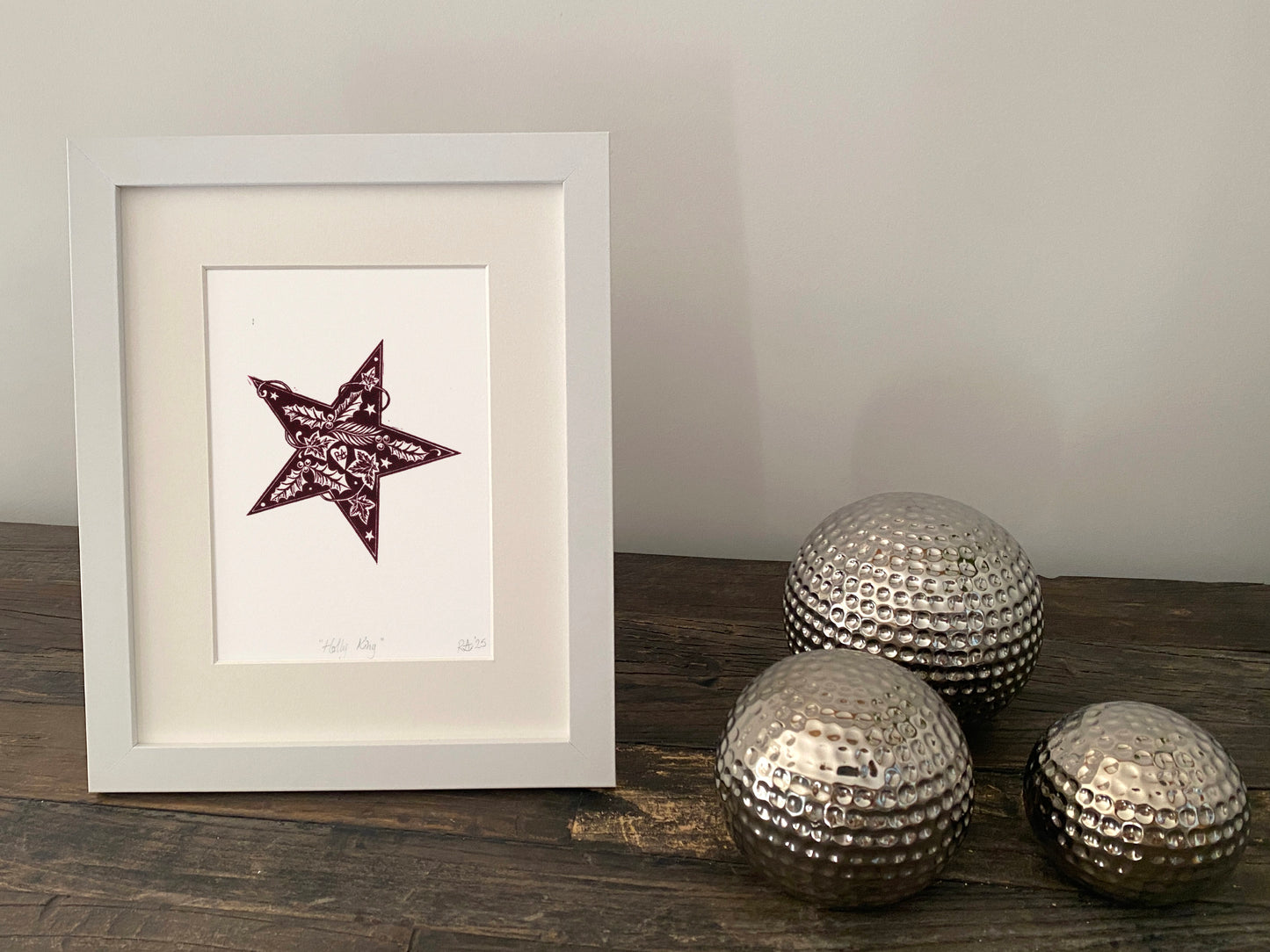 Holly King Star linoprint. Seasonal celebration print in burgundy