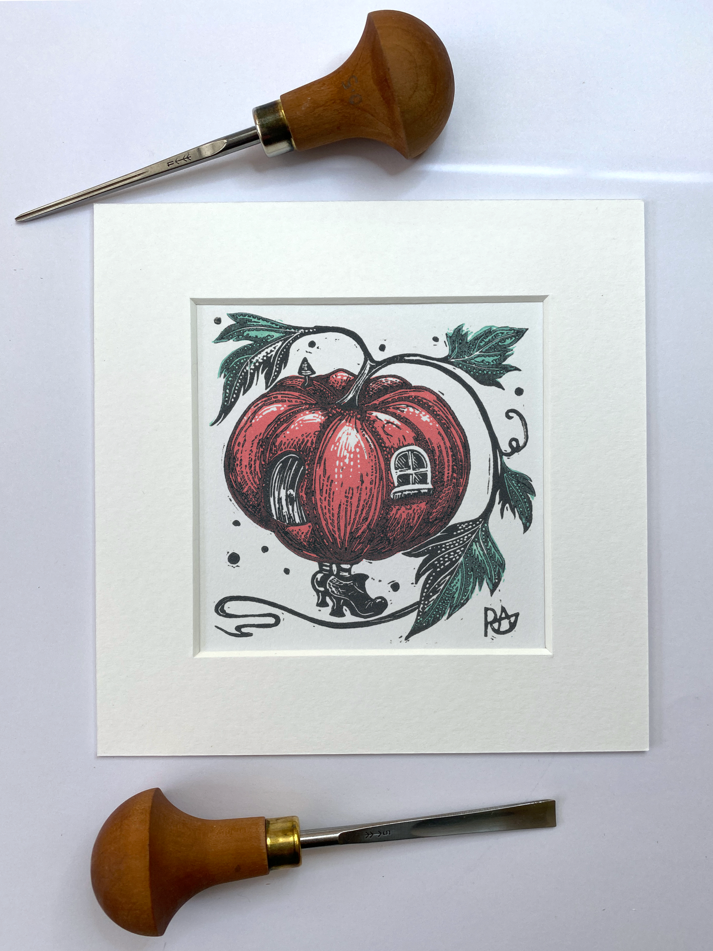 Art print of a pink pumpkin and leaves, surrounded by carving tools on a white background.