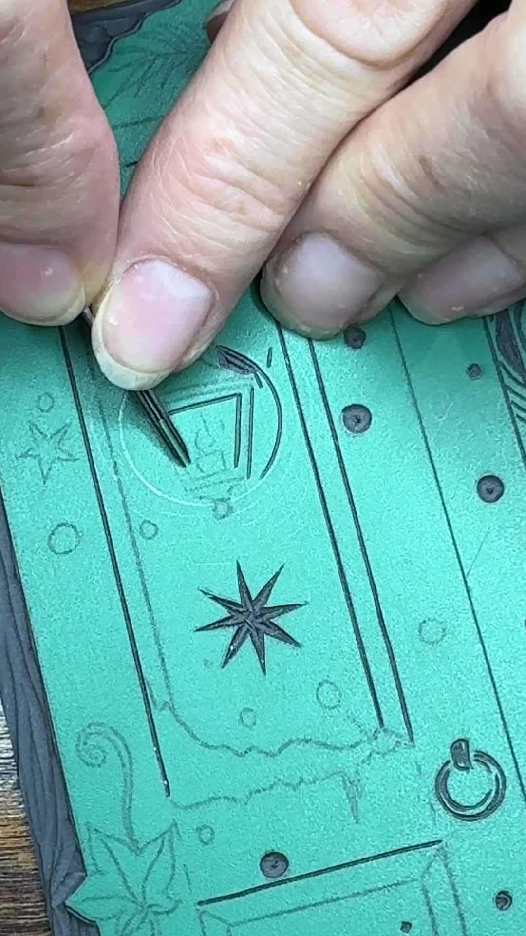 Carving of linoprint block for wardrobe Christmas card