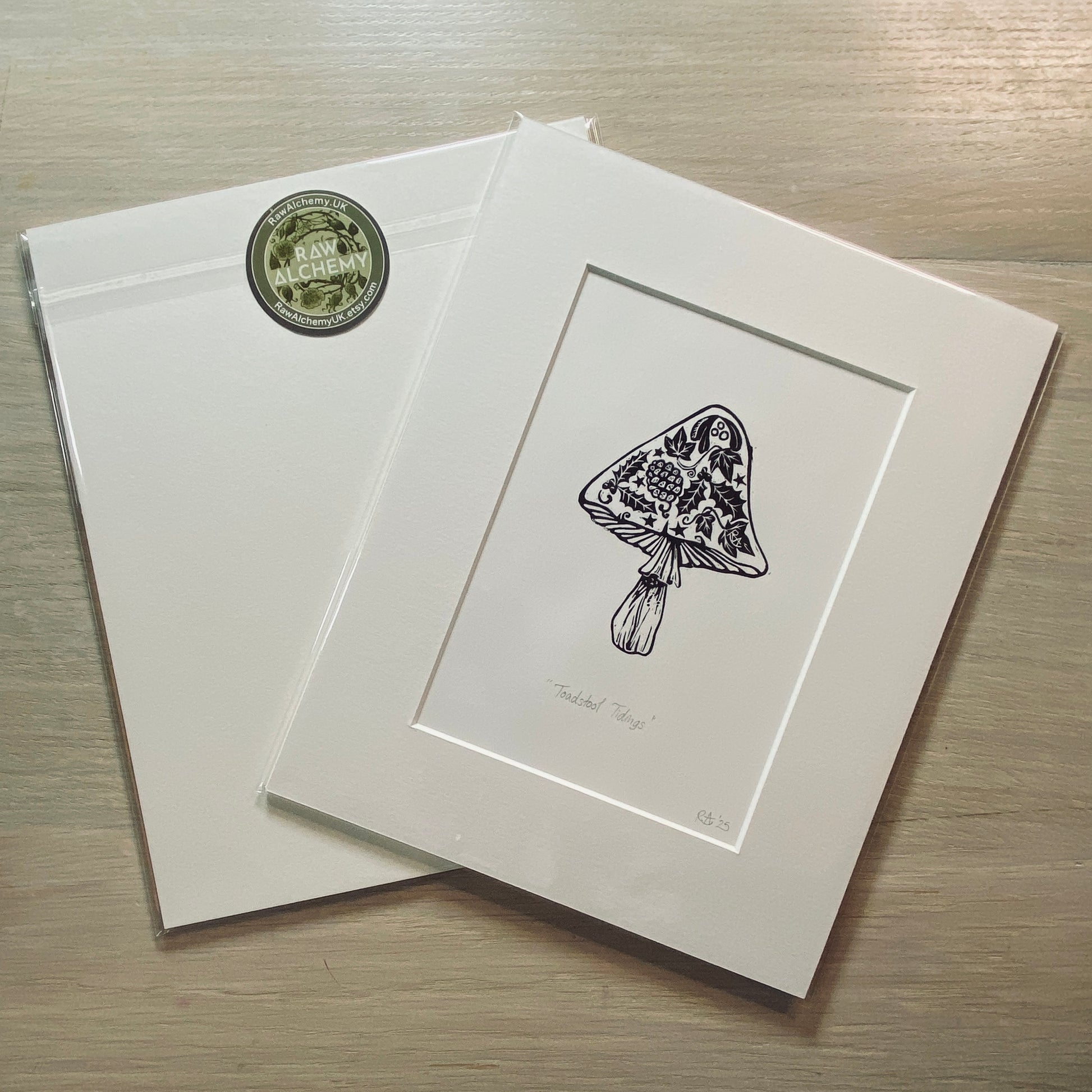 Matted artwork of a floral design on a wooden surface