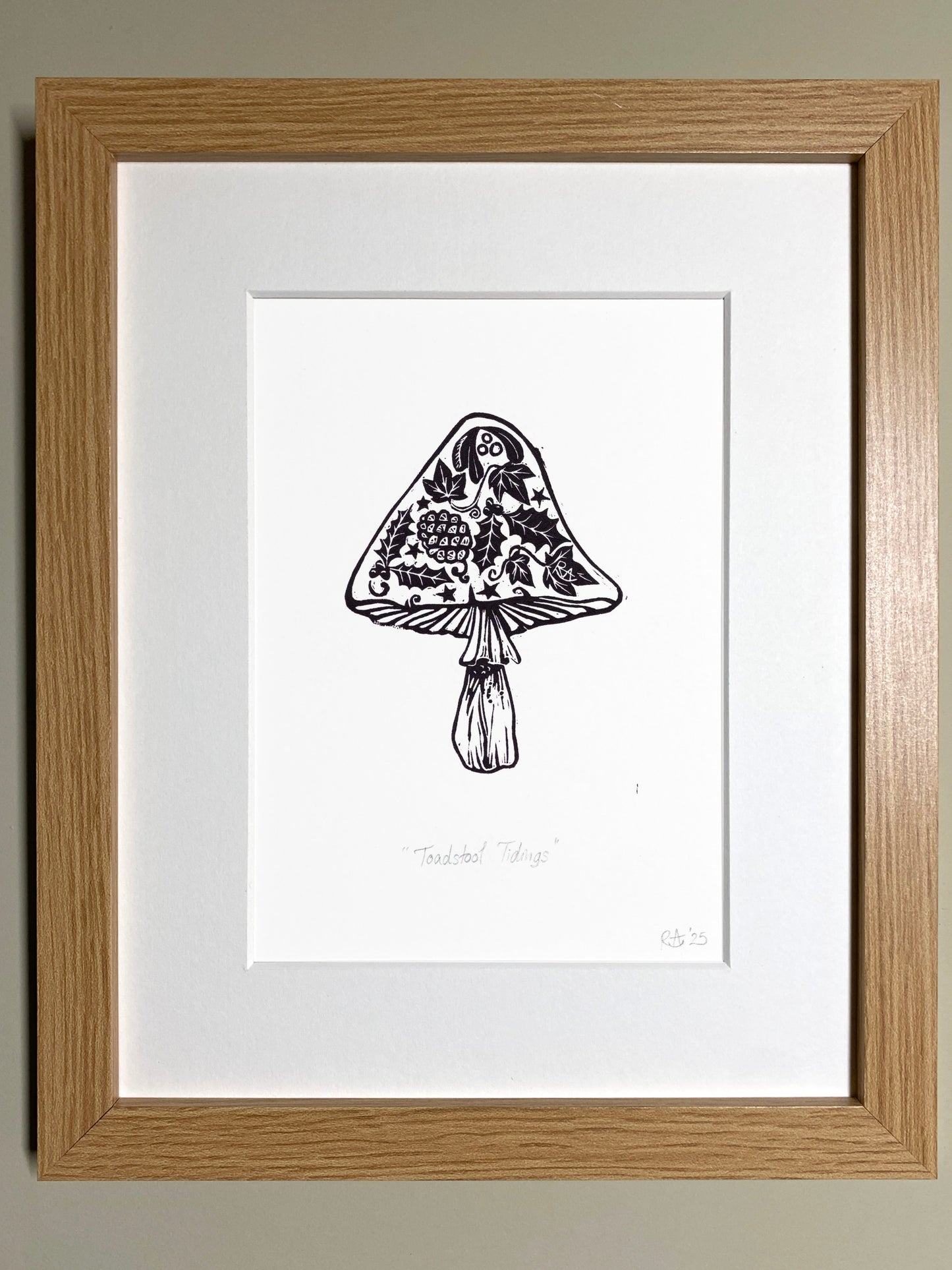 Framed black and white illustration of a decorative mushroom on a plain background